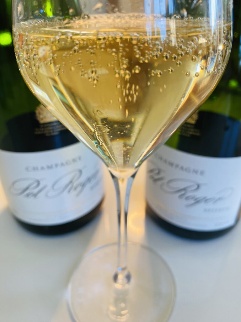 A glass of Pol Roger Champagne.